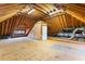 Large unfinished attic space with exposed beams, ideal for future expansion at 1093 N Lakeside Dr, Smithfield, NC 27577