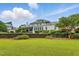 Picture perfect backyard with patio and well-maintained landscaping at 1093 N Lakeside Dr, Smithfield, NC 27577