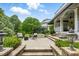 Beautiful backyard patio with manicured landscaping, comfortable seating and serene ambiance, perfect for entertaining guests at 1093 N Lakeside Dr, Smithfield, NC 27577