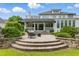 Stunning backyard with a stone patio, seating area, and manicured landscaping creating an inviting outdoor space at 1093 N Lakeside Dr, Smithfield, NC 27577
