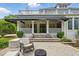 Spacious backyard patio with a seating area, perfect for outdoor dining and relaxation under the covered porch at 1093 N Lakeside Dr, Smithfield, NC 27577