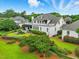 Expansive backyard with a large patio, lush landscaping, and manicured lawn, perfect for outdoor living at 1093 N Lakeside Dr, Smithfield, NC 27577