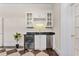Charming bar area featuring custom cabinets, granite countertops, and stainless beverage coolers at 1093 N Lakeside Dr, Smithfield, NC 27577