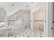 Bright bathroom featuring a pedestal sink, soaking tub, shower and wainscoting at 1093 N Lakeside Dr, Smithfield, NC 27577
