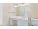 Bathroom with white vanity, large mirror, and ample lighting fixtures above at 1093 N Lakeside Dr, Smithfield, NC 27577