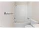 Bright bathroom features a white tiled shower and tub combo with essential fixtures at 1093 N Lakeside Dr, Smithfield, NC 27577
