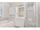 Luxurious bathroom featuring a soaking tub, vanity, and view to the bedroom at 1093 N Lakeside Dr, Smithfield, NC 27577