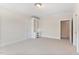 Bright bedroom featuring neutral carpet, built-in desk, and plenty of natural light at 1093 N Lakeside Dr, Smithfield, NC 27577