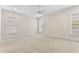 Expansive bedroom with neutral walls and carpet, ceiling fan, and large windows for ample light at 1093 N Lakeside Dr, Smithfield, NC 27577