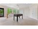 Upstairs bonus room featuring a ceiling fan, natural light and a foosball table at 1093 N Lakeside Dr, Smithfield, NC 27577