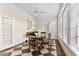 Bright kitchen breakfast nook with four chairs, ceiling fan, and a lovely view at 1093 N Lakeside Dr, Smithfield, NC 27577