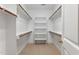 Organized walk-in closet with built-in shelving and rods for ample storage at 1093 N Lakeside Dr, Smithfield, NC 27577