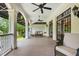 Comfortable covered porch with ceiling fans and neutral furnishings, a perfect spot for relaxing and enjoying the outdoors at 1093 N Lakeside Dr, Smithfield, NC 27577