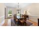 Refined dining room boasting hardwood floors, a chandelier, and traditional decor at 1093 N Lakeside Dr, Smithfield, NC 27577