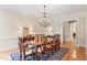 Elegant dining room with hardwood floors, chandelier, and a traditional dining set at 1093 N Lakeside Dr, Smithfield, NC 27577