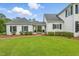 Charming home featuring well-maintained landscaping, a brick path, and a welcoming covered entry at 1093 N Lakeside Dr, Smithfield, NC 27577