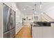 Spacious kitchen featuring stainless steel appliances, granite counters, and hardwood flooring at 1093 N Lakeside Dr, Smithfield, NC 27577