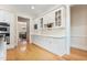 Kitchen with white cabinets and stainless steel appliances with hardwood flooring at 1093 N Lakeside Dr, Smithfield, NC 27577