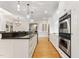 Spacious kitchen features granite counters, stainless steel appliances, and hardwood flooring at 1093 N Lakeside Dr, Smithfield, NC 27577
