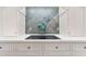 Kitchen features a modern backsplash and a smooth electric cooktop at 1093 N Lakeside Dr, Smithfield, NC 27577