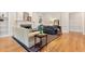 Inviting living room featuring hardwood floors, fireplace, and plush seating arrangement at 1093 N Lakeside Dr, Smithfield, NC 27577