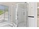 Corner shower with glass surround in well lit bathroom at 1093 N Lakeside Dr, Smithfield, NC 27577