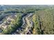 Beautiful aerial view of a neighborhood surrounded by lush green trees and manicured lawns at 1148 Dexter Ridge Dr, Holly Springs, NC 27540