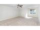 Spacious bonus room with neutral carpet, sloped ceiling, and natural light at 1148 Dexter Ridge Dr, Holly Springs, NC 27540