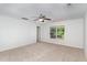 Bright bonus room features neutral carpet, and large window with natural light at 1148 Dexter Ridge Dr, Holly Springs, NC 27540