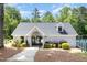 Community pool house with lush landscaping, gated entrance, and adjacent bicycle racks at 1148 Dexter Ridge Dr, Holly Springs, NC 27540