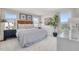 Stylish bedroom with patterned bedding, modern furniture, a large window, and bright natural light at 1167 Abbott St, Mebane, NC 27302