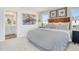 Bright bedroom with comfortable bed and colorful art, adjacent to a well-appointed bathroom at 1167 Abbott St, Mebane, NC 27302