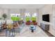 Bright living room with comfortable seating, large windows, stylish decor, and an open concept design at 1167 Abbott St, Mebane, NC 27302