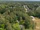 Expansive aerial view of the community surrounded by mature trees and lush landscapes at 120 Harmony Hill Ln, Cary, NC 27513