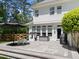Outdoor backyard patio featuring seating, a grill, and an umbrella perfect for entertaining at 120 Harmony Hill Ln, Cary, NC 27513