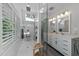Bright bathroom with dual sinks, modern fixtures, natural light, and separate glass shower at 120 Harmony Hill Ln, Cary, NC 27513