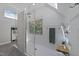 Modern walk-in shower featuring light tile and natural light from the window at 120 Harmony Hill Ln, Cary, NC 27513
