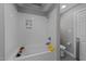 Bright bathroom with a combined bathtub and shower, complete with tiled walls and modern fixtures at 120 Harmony Hill Ln, Cary, NC 27513