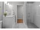 Modern bathroom featuring marble floors, glass enclosed shower, and a stylish white vanity at 120 Harmony Hill Ln, Cary, NC 27513