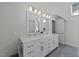 Double sink vanity with countertop space and plenty of storage cabinets in a well-lit bathroom at 120 Harmony Hill Ln, Cary, NC 27513