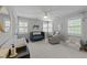 Bright Bedroom features a cozy glider, crib, and changing table with natural light from multiple windows at 120 Harmony Hill Ln, Cary, NC 27513