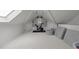 Bonus room offers a fitness area featuring an exercise bike with natural light from the skylight at 120 Harmony Hill Ln, Cary, NC 27513