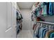 Walk-in closet with multiple shelves, hanging racks, and ample storage at 120 Harmony Hill Ln, Cary, NC 27513