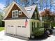 Charming home featuring a two-car garage, dormer windows, and a well-manicured landscape at 120 Harmony Hill Ln, Cary, NC 27513
