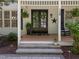 Charming front door, sidelights, stone walkway, and landscaped garden at 120 Harmony Hill Ln, Cary, NC 27513