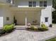 Inviting front porch with swing, stone walkway, and lush landscaping at 120 Harmony Hill Ln, Cary, NC 27513