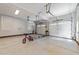A well-lit three car garage with epoxy flooring and plenty of storage space at 120 Harmony Hill Ln, Cary, NC 27513