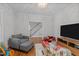 Comfortable living room with hardwood floors and an open entryway to the stairs at 120 Harmony Hill Ln, Cary, NC 27513