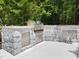 Outdoor kitchen featuring stainless steel appliances and stone surround at 120 Harmony Hill Ln, Cary, NC 27513