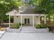 Charming pool house with covered porch, ceiling fans, and landscaped surroundings at 120 Harmony Hill Ln, Cary, NC 27513